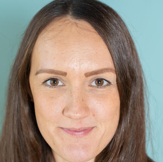 A head shot of Karla smiling directly at the camera